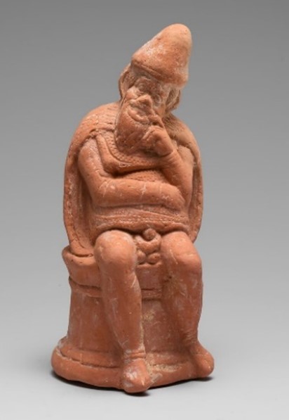 Πήλινο ειδώλιο κωμικού υποκριτή (New York Group), ο οποίος φέρει τη σκευή του δούλου. 400-350 π.Χ. New York, The Metropolitan Museum of Art 13.225.16.