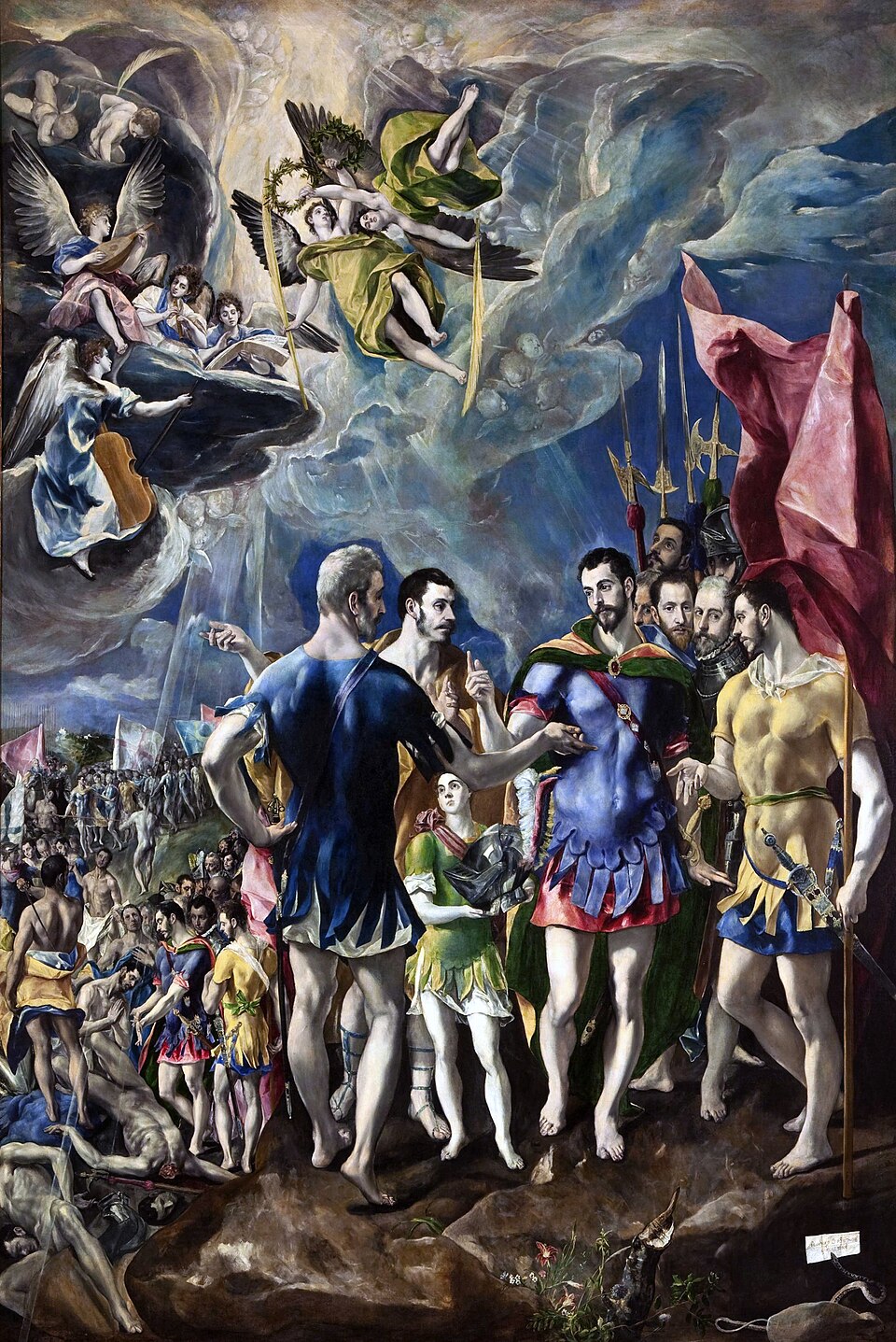 Ελ Γκρέκο, El martirio de San Mauricio y la Legión Tebana [Το μαρτύριο του Αγίου Μαυρικίου και της Θηβαϊκής Λεγεώνας], περ. 1580-1582, λάδι σε καμβά, 445 x 294 εκ. Η σύνθεση οργανώνεται ως θεατρικό ταμπλώ: στο προσκήνιο, ο Άγιος Μαυρίκιος και οι αξιωματικοί του εκτελούν ρητορικές χειρονομίες [adlocutio] με έντονα μανιεριστικό στυλιζάρισμα, σαν ηθοποιοί τραγωδίας που απαγγέλλουν τον λόγο τους, ενώ η καθαυτό βίαιη σκηνή του μαρτυρίου μετατοπίζεται στο βάθος. Στο επάνω τμήμα, χορωδία αγγέλων με έγχορδα και πνευστά (λαούτο, βιόλα, φλάουτο) πλαισιώνει μουσικά τη δράση, ενισχύοντας τη θεατρικότητα της σύνθεσης. Ο Φίλιππος Β΄ της Ισπανίας απέρριψε τον πίνακα ακριβώς λόγω αυτής της μανιέρας: η εκλεπτυσμένη, διανοητική διάταξη του Θεοτοκόπουλου παρέβλεπε τους κανόνες της Αντιμεταρρύθμισης, οι οποίοι απαιτούσαν τη φρικτή σκηνή του μαρτυρίου σε πρώτο πλάνο, ώστε να προκαλεί άμεσα θρησκευτική ευλάβεια. Real Monasterio de San Lorenzo de El Escorial [Βασιλικό Μοναστήρι του Αγίου Λαυρεντίου του Εσκοριάλ], Μαδρίτη (αρ. ευρ. 10014707).