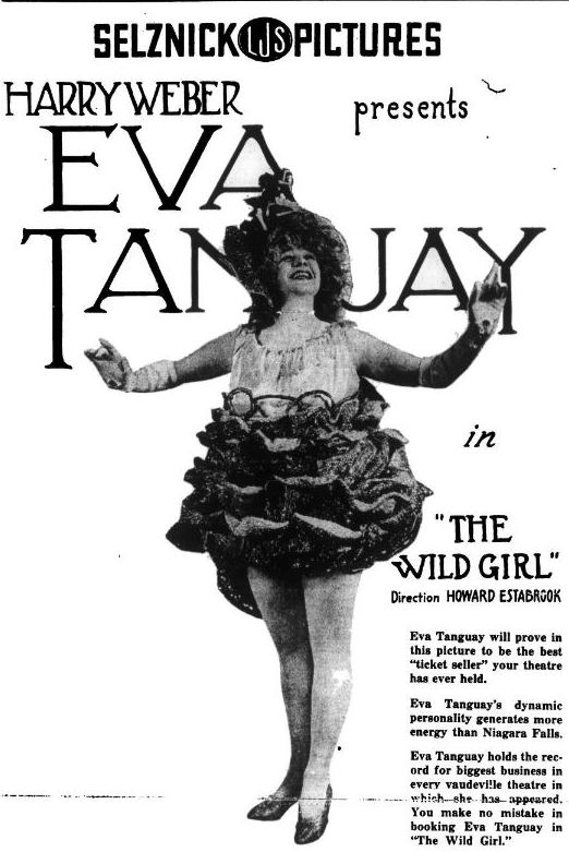Η Eva Tanguay [Εύα Τάνγκουεϋ] σε εορταστική διαφήμιση στο περιοδικό Variety (28 Δεκεμβρίου 1917). Η Καναδοαμερικανίδα ερμηνεύτρια του βωντβίλ διακρίθηκε για τα εκκεντρικά κοστούμια, την έντονη κινητικότητα και την αντισυμβατική σκηνική περσόνα της, αποτελώντας εμβληματική μορφή της σόου γούμαν των αρχών του 20ού αιώνα.