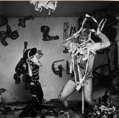 Στιγμιότυπο χάπενινγκ του [[#Claes Oldenburg [Κλες Όλντενμπουργκ]#]], Snapshots from the City, 1960, Judson Gallery, Νέα Υόρκη.